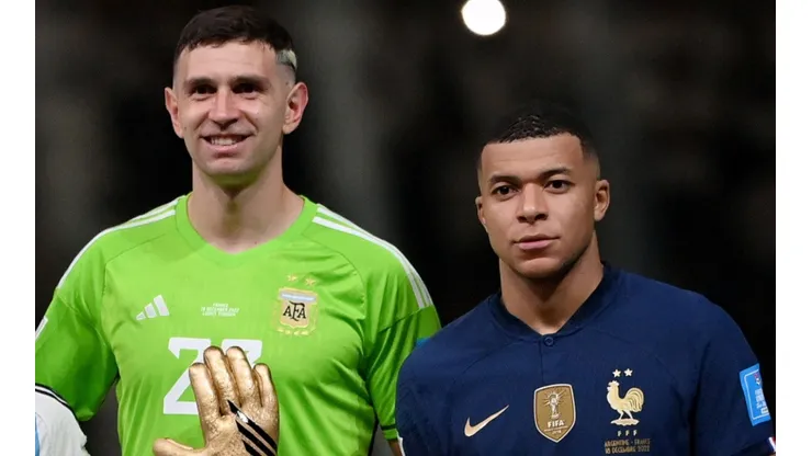 Emiliano Martinez of Argentina and Kylian Mbappe of France