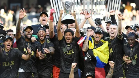 Carlos Vela of Los Angeles FC lifts the championship trophy