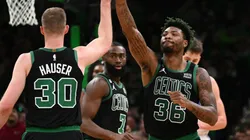 Marcus Smart of the Boston Celtics high-fives Sam Hauser