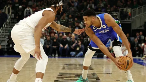 Giannis Antetokounmpo of the Milwaukee Bucks is defended by Lamar Stevens of the Cleveland Cavaliers