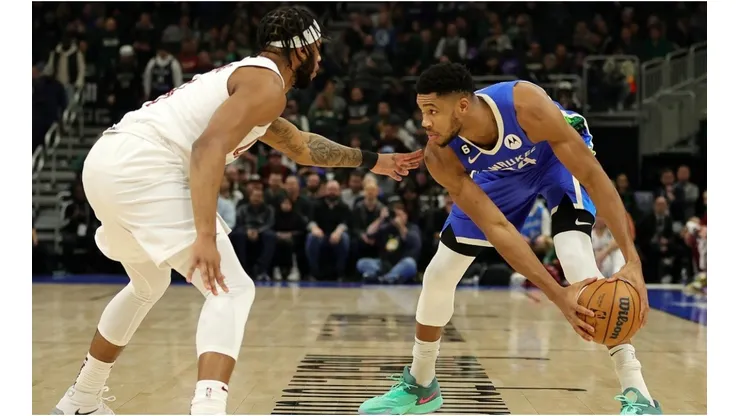 Giannis Antetokounmpo of the Milwaukee Bucks is defended by Lamar Stevens of the Cleveland Cavaliers