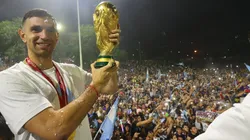 Argentina goalkeeper Emiliano 'Dibu' Martinez with the World Cup trophy in front of the fans.