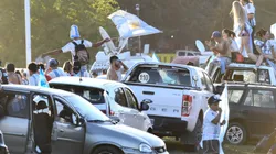 Fans of Argentina wave flags outside Argentina's training facilities