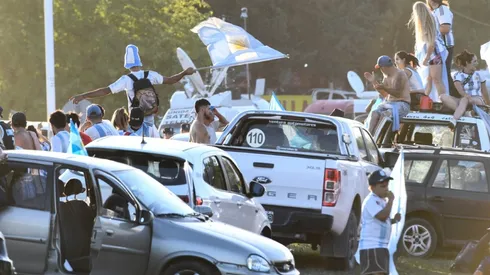 Fans of Argentina wave flags outside Argentina's training facilities
