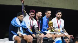 Leandro Paredes, Rodrigo De Paul, Lionel Messi, Angel Di Maria and Nicolas Otamendi celebrate on the bus during the arrival of the Argentina men's national football team after winning the FIFA World Cup Qatar 2022 on December 20, 2022 in Buenos Aires, Argentina.