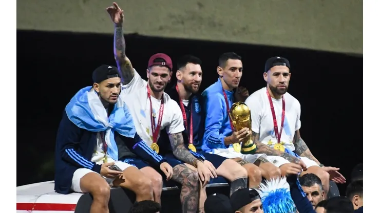 Leandro Paredes, Rodrigo De Paul, Lionel Messi, Angel Di Maria and Nicolas Otamendi celebrate on the bus during the arrival of the Argentina men's national football team after winning the FIFA World Cup Qatar 2022 on December 20, 2022 in Buenos Aires, Argentina.