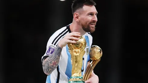 Lionel Messi of Argentina touches the FIFA World Cup Winners