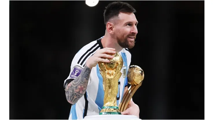 Lionel Messi of Argentina touches the FIFA World Cup Winners