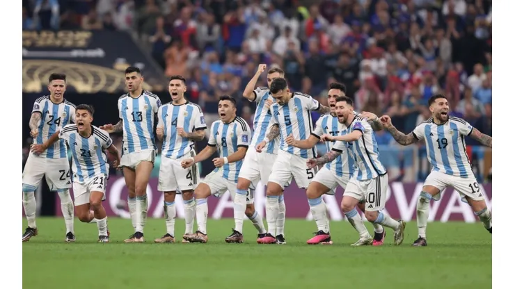 Lionel Messi of Argentina celebrates with teammates in the penalty shootout during the FIFA World Cup Qatar 2022.