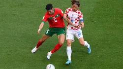 Nayef Aguerd of Morocco battles for possession with Luka Modric of Croatia