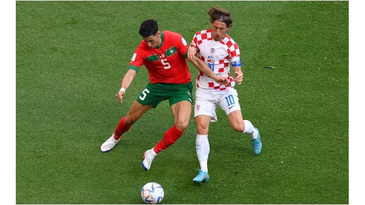 Nayef Aguerd of Morocco battles for possession with Luka Modric of Croatia
