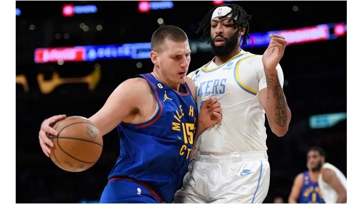 Nikola Jokic of the Denver Nuggets pushes against Anthony Davis of the Los Angeles Lakers