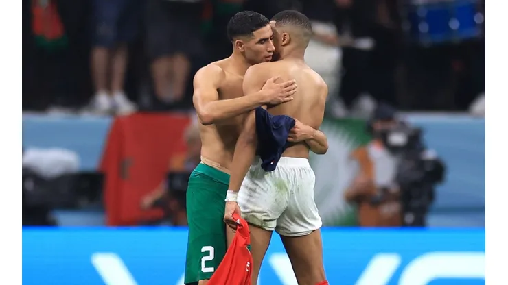 Achraf Hakimi of Morocco swaps shirts with Kylian Mbappe of France