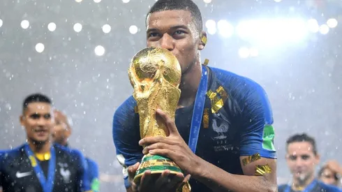 Kylian Mbappe with the FIFA World Cup trophy in 2018.
