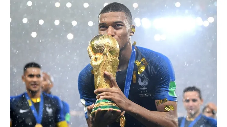 Kylian Mbappe with the FIFA World Cup trophy in 2018.