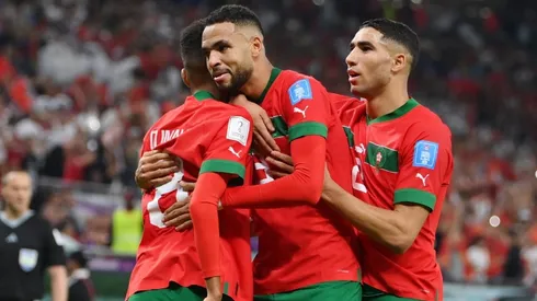 Moroccan players celebrating a goal against Portugal.