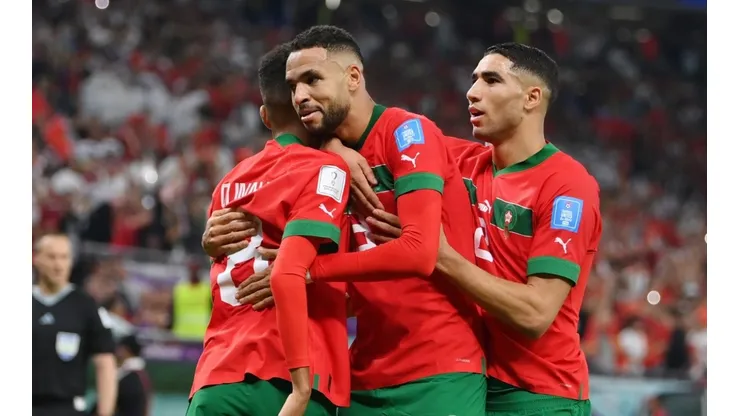 Moroccan players celebrating a goal against Portugal.