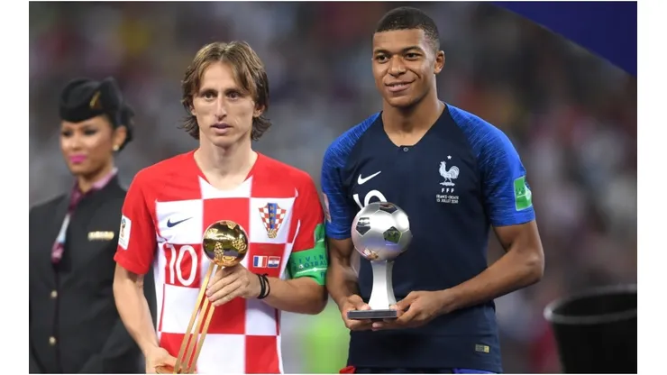 Luka Modric of Croatia and Kylian Mbappe of France pose respectively with their the adidas Golden Ball and with the FIFA Young Player award