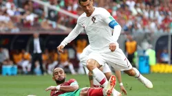 Cristiano Ronaldo of Portugal is fouled by Mehdi Benatia of Morocco