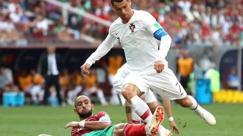 Cristiano Ronaldo of Portugal is fouled by Mehdi Benatia of Morocco