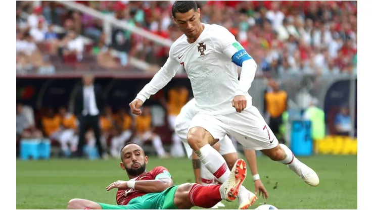 Cristiano Ronaldo of Portugal is fouled by Mehdi Benatia of Morocco