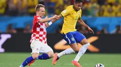 Luka Modric of Croatia tackles Neymar of Brazil during the 2014 FIFA World Cup