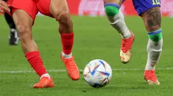 Players fight for the ball at the World Cup