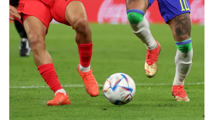 Players fight for the ball at the World Cup