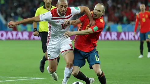 Noureddine Amrabat of Morocco battles with Andres Iniesta of Spain