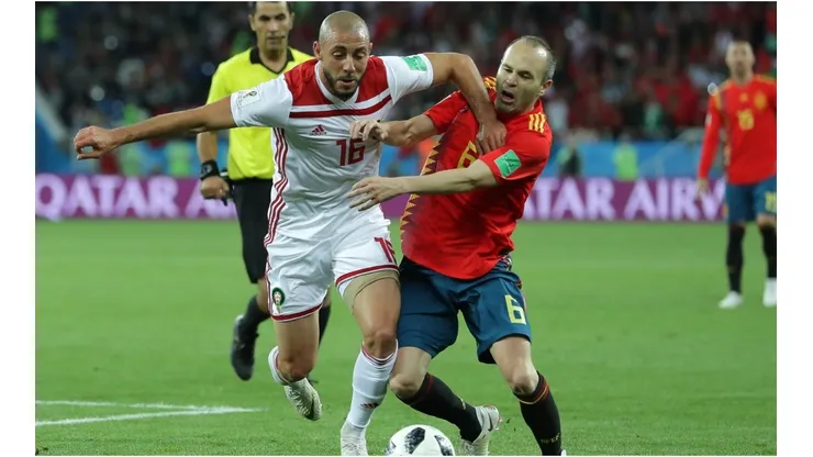 Noureddine Amrabat of Morocco battles with Andres Iniesta of Spain