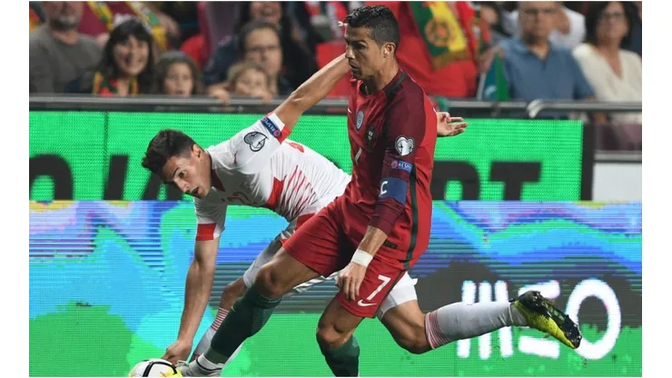 Cristiano Ronaldo of Portugal competes for the ball with Fabian Schar of Switzerland during the FIFA 2018 World Cup Qualifier