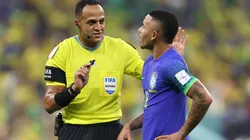 Referee Ismail Elfath speaks to Gabriel Jesus of Brazil