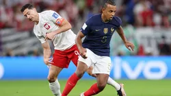 Jules Kounde of France battles for possession