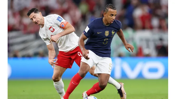 Jules Kounde of France battles for possession