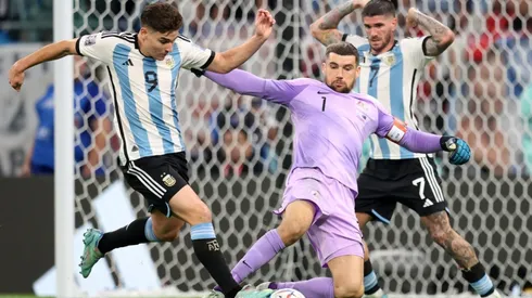 Julian Alvarez of Argentina scores the team's second goal past Mathew Ryan of Australia