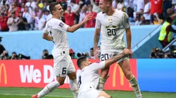 Sergej Milinkovic-Savic of Serbia (r) celebrates after scoring their team's second goal with their teammates Aleksandar Mitrovic (c) and Nemanja Maksimovic during the FIFA World Cup Qatar 2022 Group G match between Cameroon and Serbia at Al Janoub Stadium on November 28, 2022 in Al Wakrah, Qatar.