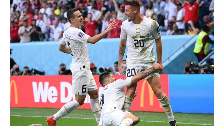 Sergej Milinkovic-Savic of Serbia (r) celebrates after scoring their team's second goal with their teammates Aleksandar Mitrovic (c) and Nemanja Maksimovic during the FIFA World Cup Qatar 2022 Group G match between Cameroon and Serbia at Al Janoub Stadium on November 28, 2022 in Al Wakrah, Qatar.