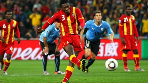 Asamoah Gyan of Ghana shoots a late penalty
