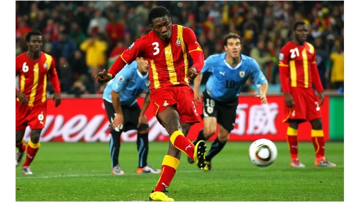 Asamoah Gyan of Ghana shoots a late penalty