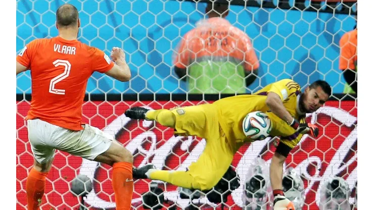Sergio Romero of Argentina saves the penalty kick of Ron Vlaar of the Netherlands at the 2014 FIFA World Cup