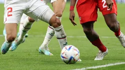 Players fight for the ball at the World Cup