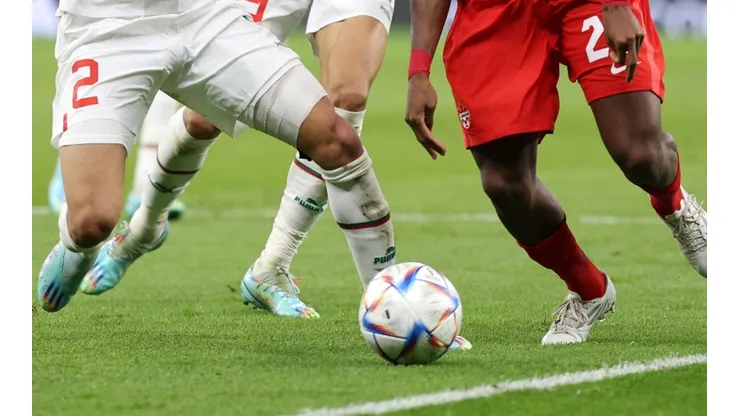 Players fight for the ball at the World Cup