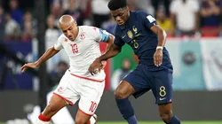 Wahbi Khazri of Tunisia against Aurelien Tchouameni of France.