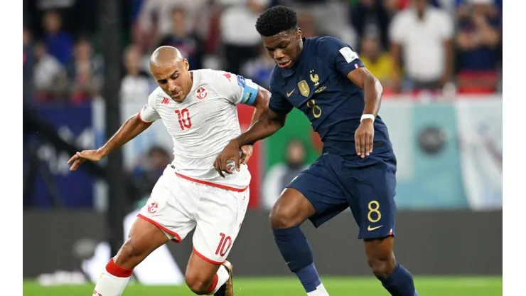Wahbi Khazri of Tunisia against Aurelien Tchouameni of France.