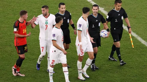 Morocco players protest to match officials at the half time