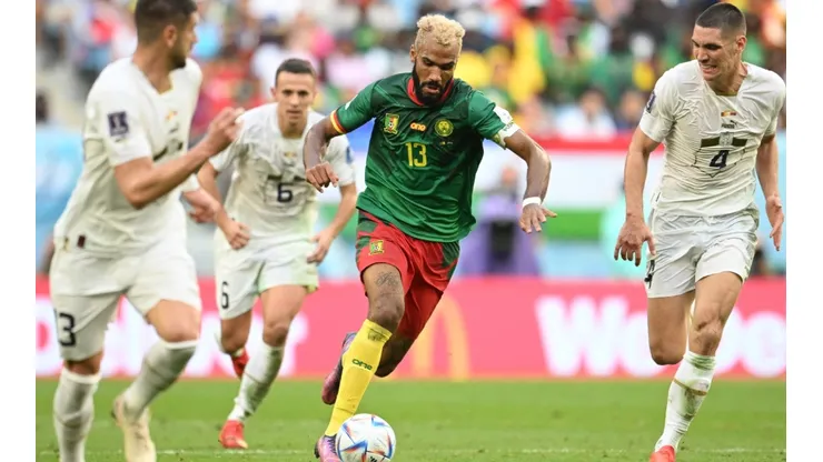 Eric Maxim Choupo-Moting of Cameroon controls the ball against Nikola Milenkovic of Serbia.