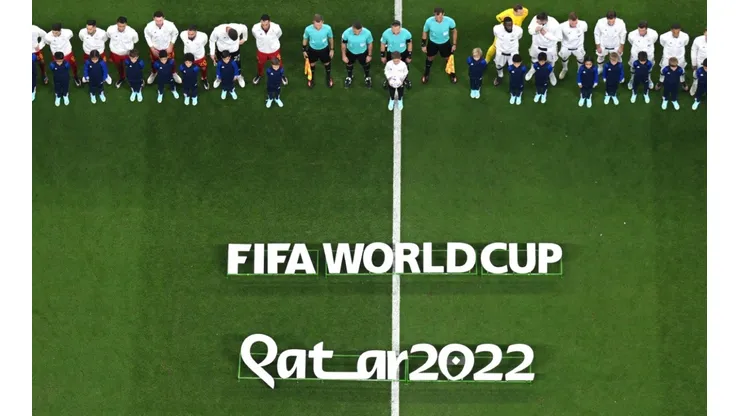 Players line up prior to a 2022 Qatar World Cup game