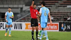 Mohammed Abdulla Hassan Mohamed shows yellow card
