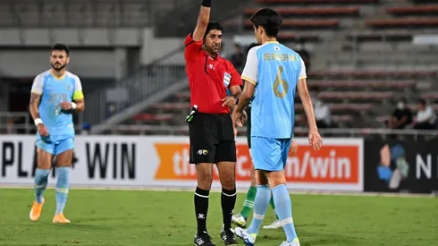 Mohammed Abdulla Hassan Mohamed shows yellow card