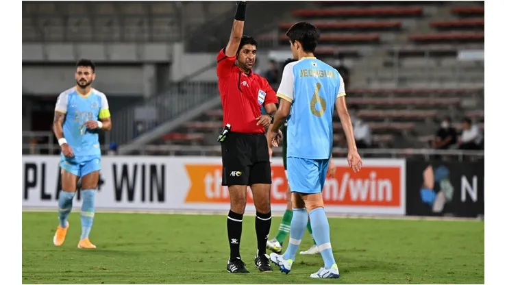 Mohammed Abdulla Hassan Mohamed shows yellow card